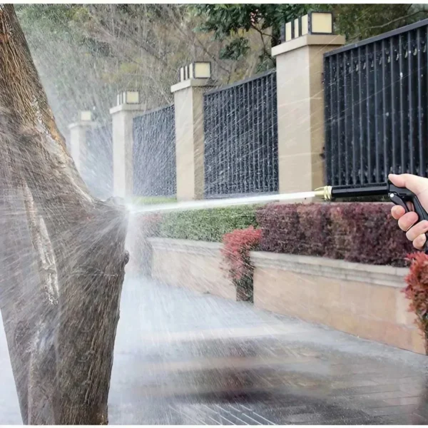 Water spraying from a garden hose.