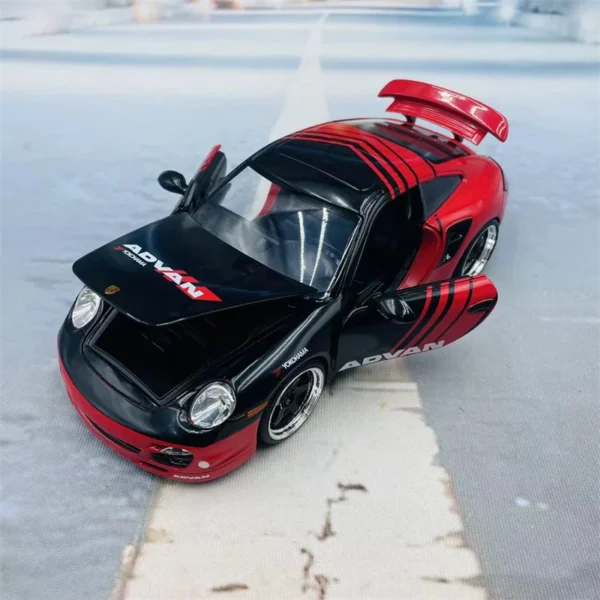 Black and red toy Porsche with Advan logo.