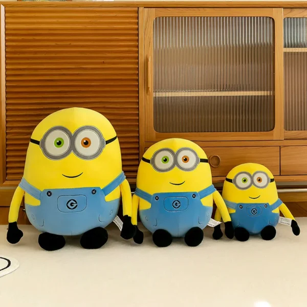 Three plush Minions in different sizes.