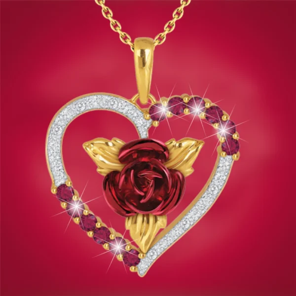 Gold heart pendant with red rose and gems.